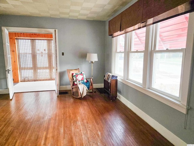 unfurnished room featuring hardwood / wood-style flooring