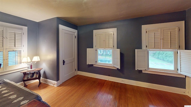 unfurnished bedroom with wood-type flooring