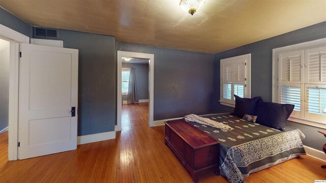 bedroom featuring hardwood / wood-style floors