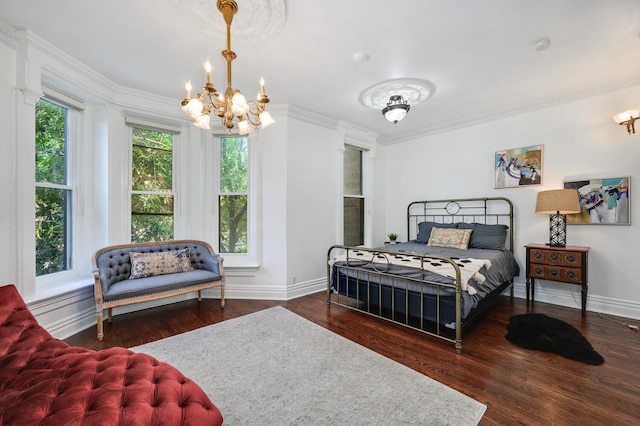 bedroom featuring crown molding, dark wood-type flooring, and an inviting chandelier