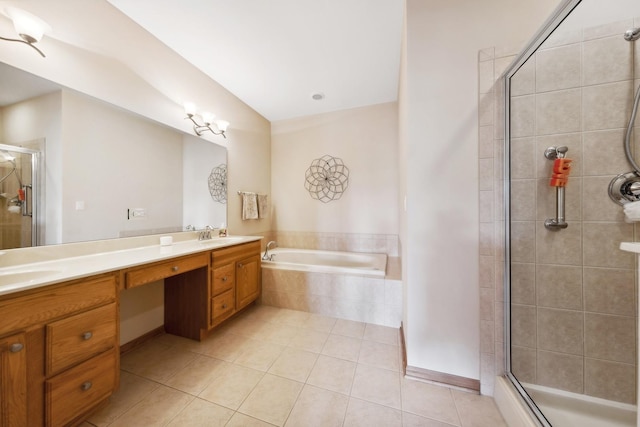 bathroom with vanity, tile patterned floors, and shower with separate bathtub