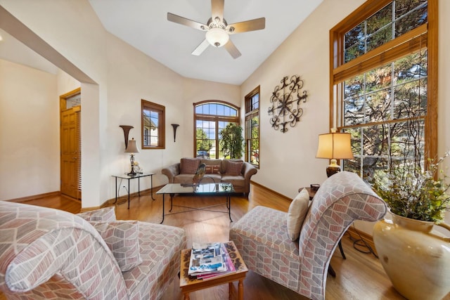 living room featuring ceiling fan and light wood-type flooring