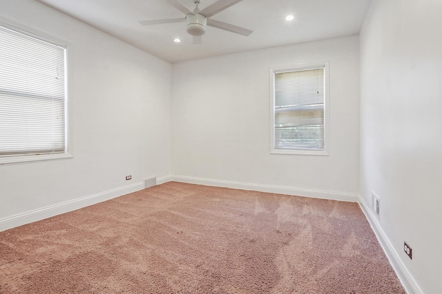 empty room with carpet flooring and ceiling fan