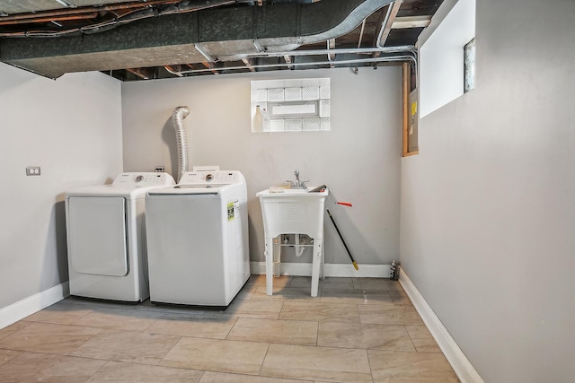 laundry area with washing machine and clothes dryer