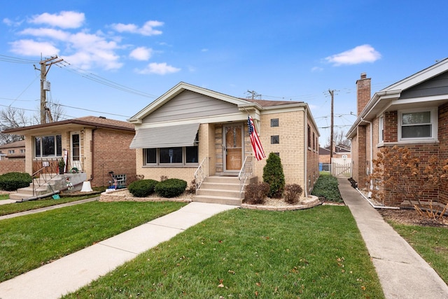 bungalow-style house with a front yard