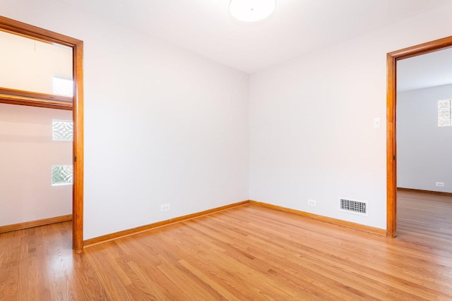 unfurnished bedroom featuring a closet and light hardwood / wood-style floors