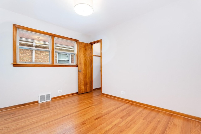 unfurnished room with light hardwood / wood-style floors