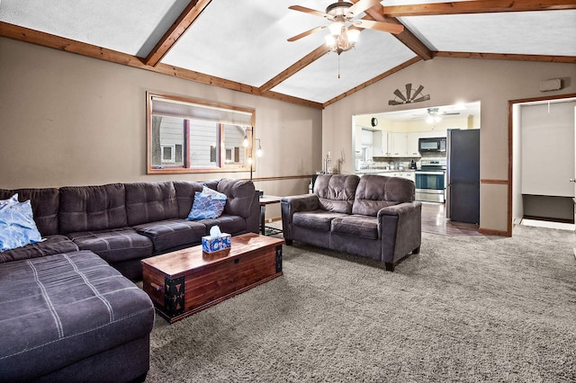 living room with vaulted ceiling with beams, carpet floors, and ceiling fan