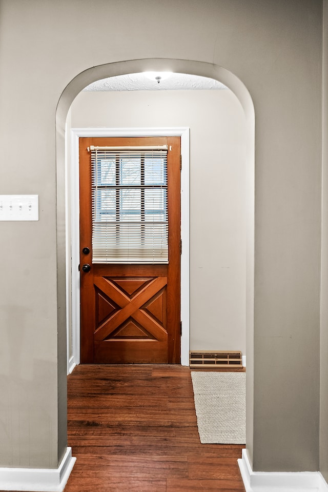 doorway featuring dark hardwood / wood-style flooring