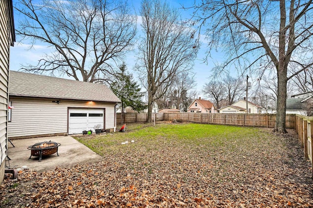 view of yard with a fire pit