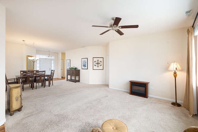 interior space featuring ceiling fan with notable chandelier