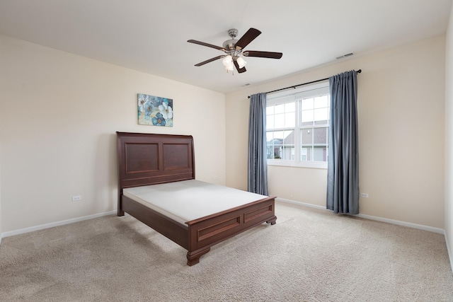 unfurnished bedroom with light carpet and ceiling fan