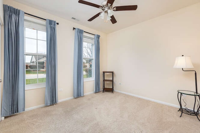 empty room with light carpet and ceiling fan