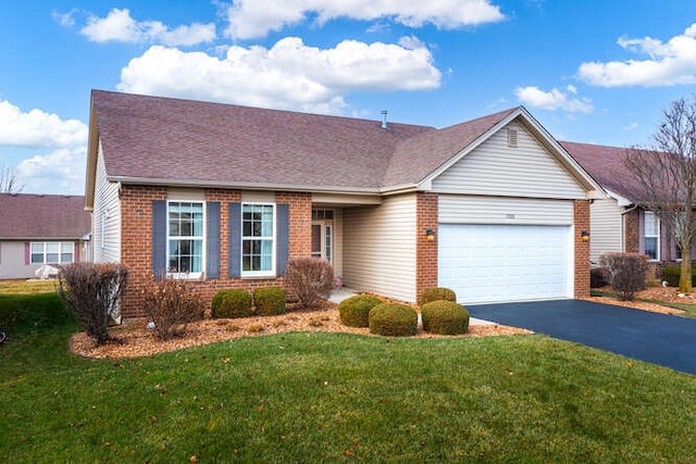 ranch-style home with a garage and a front lawn