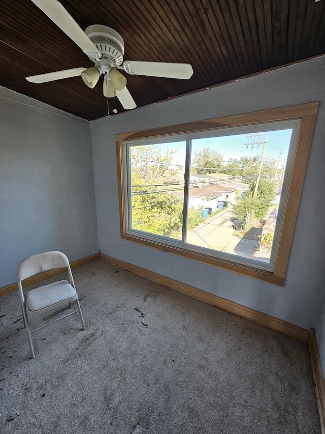 spare room with ceiling fan, carpet floors, and a healthy amount of sunlight