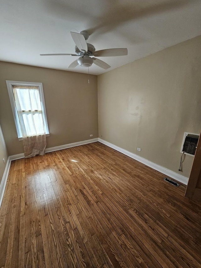 unfurnished room featuring ceiling fan and wood-type flooring