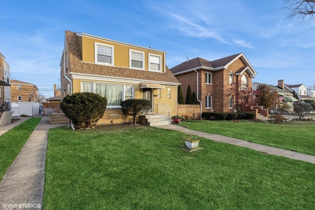 view of property featuring a front lawn