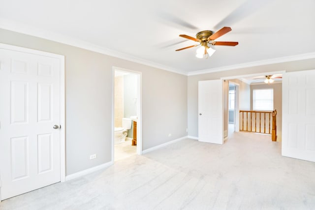 unfurnished bedroom with light colored carpet, ensuite bath, ceiling fan, and ornamental molding