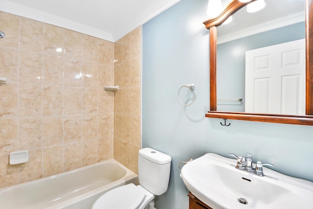 full bathroom featuring crown molding, toilet, vanity, and tiled shower / bath