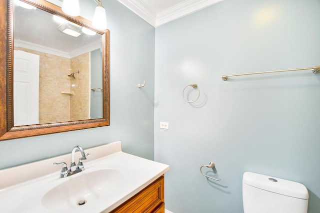 bathroom featuring vanity, toilet, and crown molding