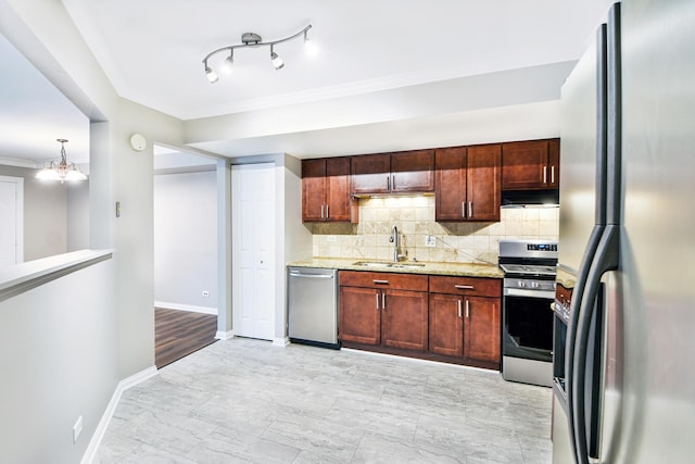 kitchen featuring appliances with stainless steel finishes, backsplash, crown molding, sink, and a chandelier