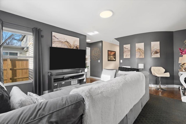 living room with dark hardwood / wood-style flooring