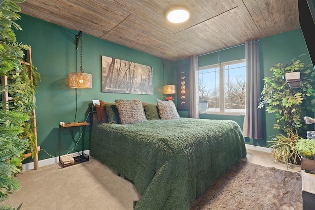 bedroom featuring carpet floors and wooden ceiling