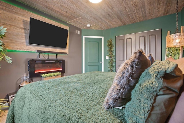 bedroom with a closet and wooden ceiling