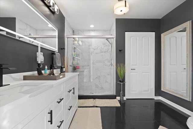 bathroom with tile patterned floors, vanity, and a shower with shower door