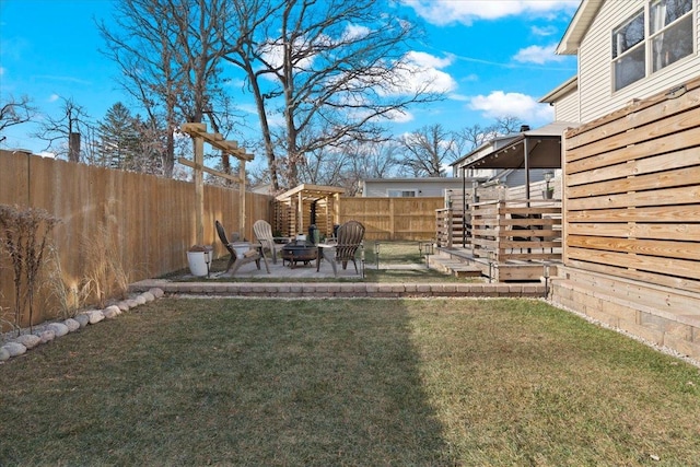 view of yard featuring a patio area and a fire pit