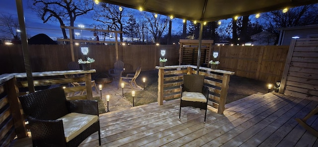 wooden deck with a fire pit