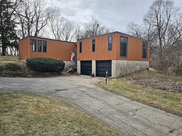 view of side of property with a garage