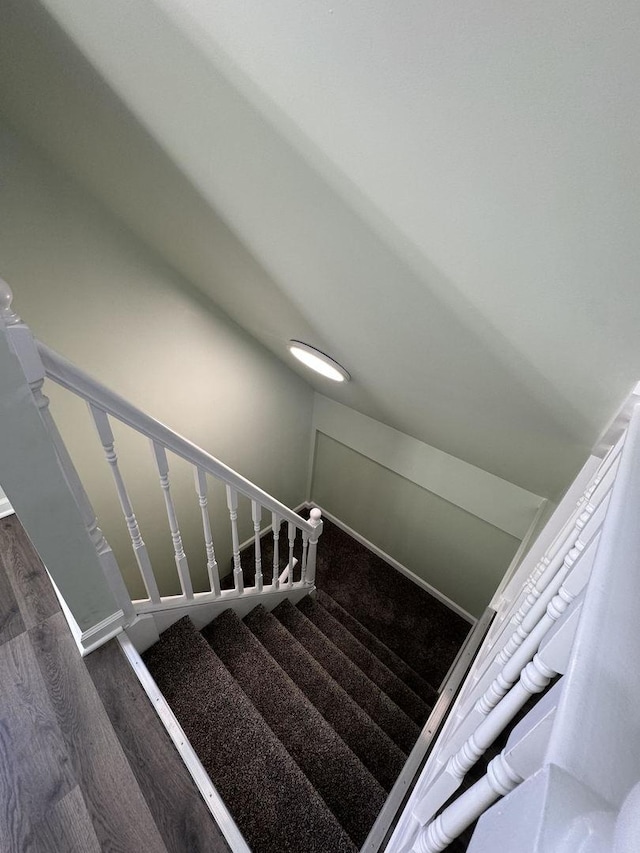 staircase featuring hardwood / wood-style flooring