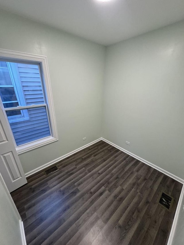 unfurnished room featuring dark hardwood / wood-style floors