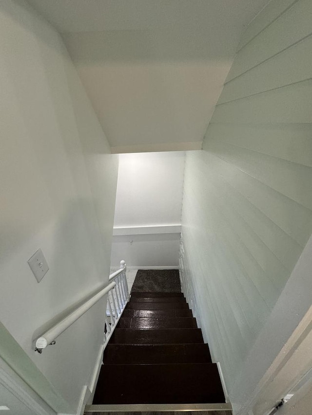 stairs featuring hardwood / wood-style flooring