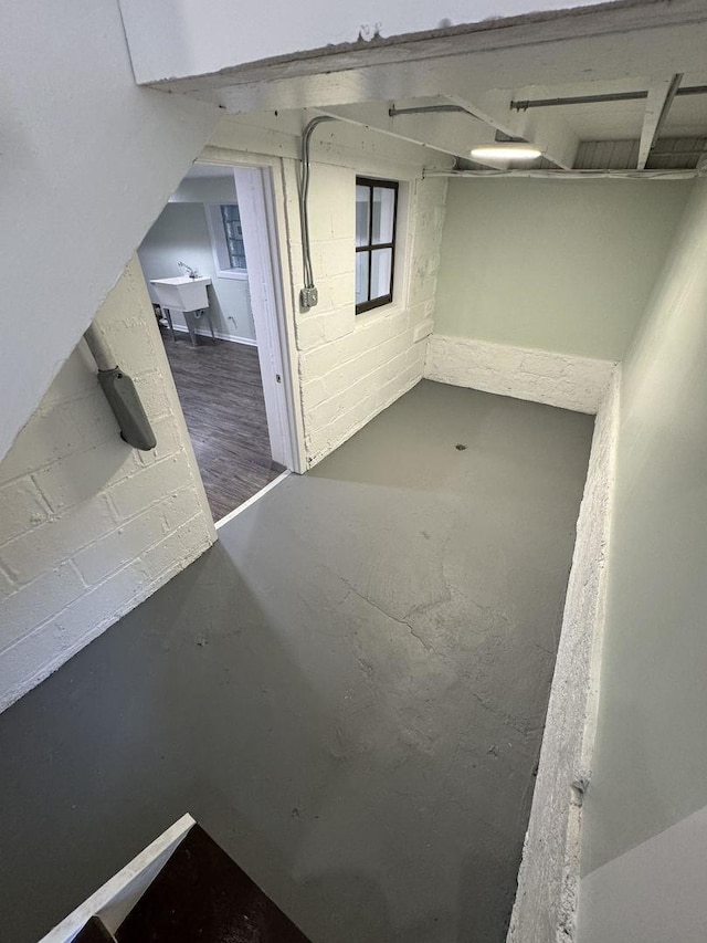 interior space featuring sink and wood-type flooring