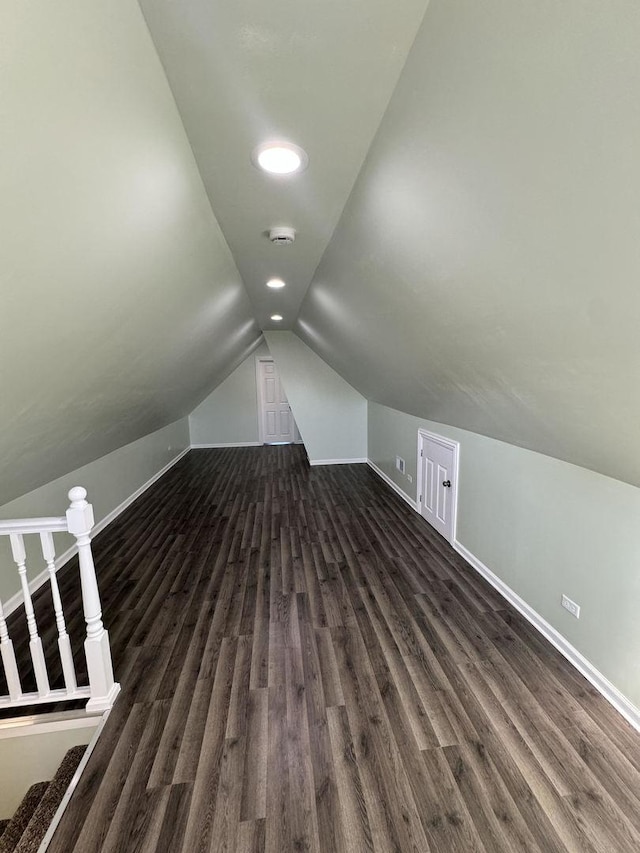 bonus room featuring vaulted ceiling and dark hardwood / wood-style floors