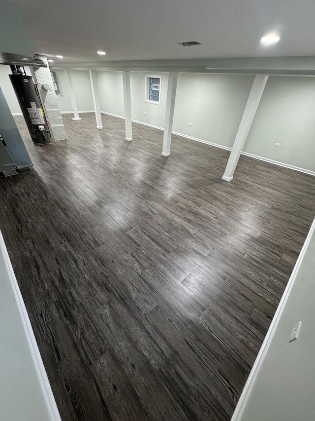 basement featuring dark hardwood / wood-style floors