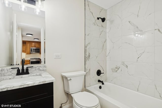 full bathroom featuring vanity, tiled shower / bath combo, and toilet