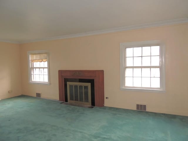 unfurnished living room featuring carpet and crown molding