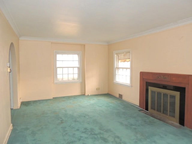 unfurnished living room with carpet floors and ornamental molding