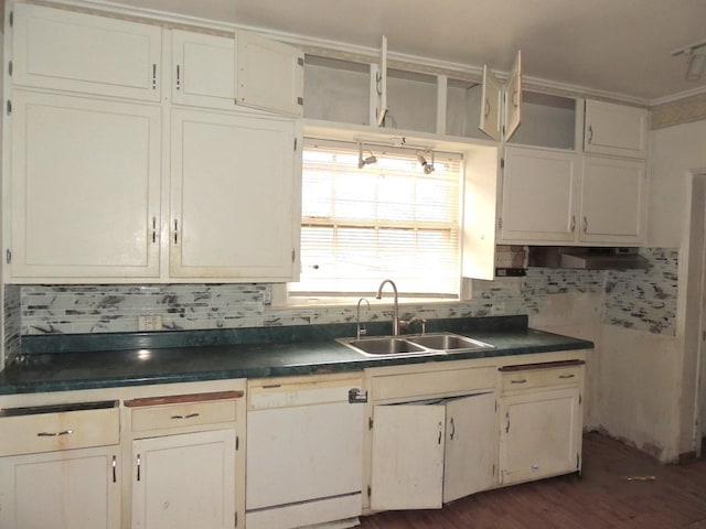 kitchen with backsplash, white dishwasher, dark wood-type flooring, and sink