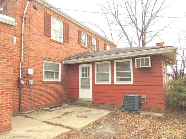 back of house with central AC and a patio area