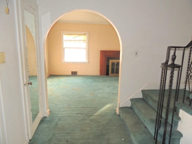 corridor with dark colored carpet