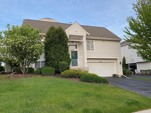 view of front facade featuring a garage and a front lawn