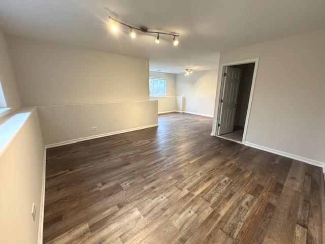 empty room featuring dark hardwood / wood-style floors