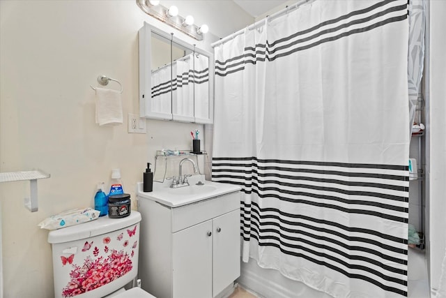 full bathroom with vanity, toilet, and shower / bath combo with shower curtain