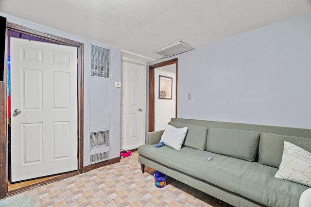 living room featuring parquet flooring