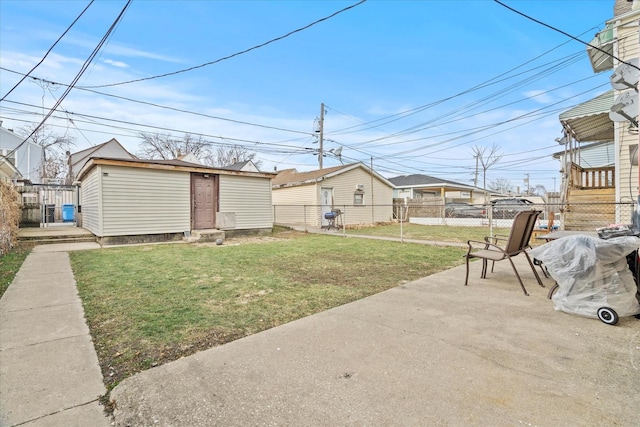 view of yard featuring an outbuilding and a patio area