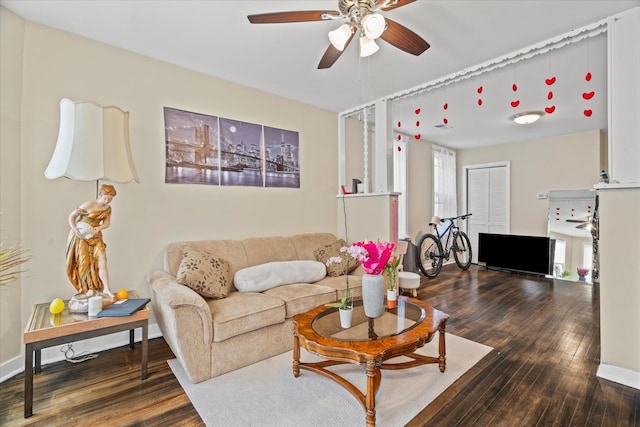 living room with hardwood / wood-style floors, plenty of natural light, and ceiling fan